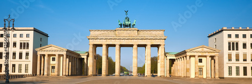 Brandenburg Gate in Berlin, Germany, on a bright day with blue s