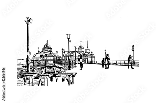 Building view with landmark of Eastbourne is a resort town on England. Hand drawn sketch illustration in vector.