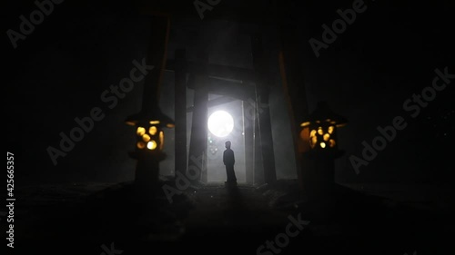 Creative artwork decoration. Abstract Japanese style wooden tunnel at night. Night scene in fantasy forest. Selective focus