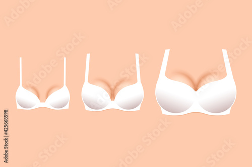Three white brassieres with cups of different sizes