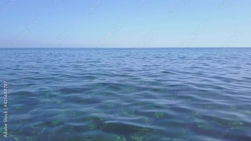 Clear transparent sea ocean surface. Calm waves aerial view Clear transparent sea ocean surface. Calm waves aerial view