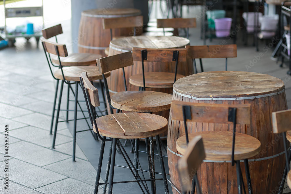 Wine barrels converted to bar tables and chairs, good idea, beautiful design in the restaurant.