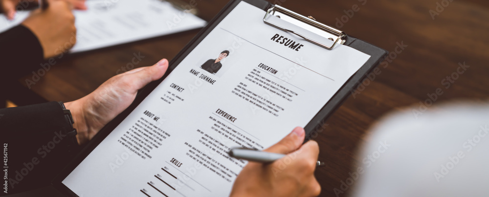Naklejka premium Businesswoman submits resume employer to review job application information on the desk, presents the ability for the company to agree with the position of the job.