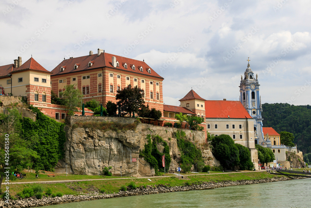 Blue Church and buildings in Austria along Danube river
