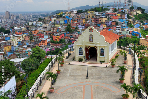 view of church with colorful houses 