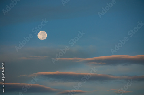 full moon in a clear sunset