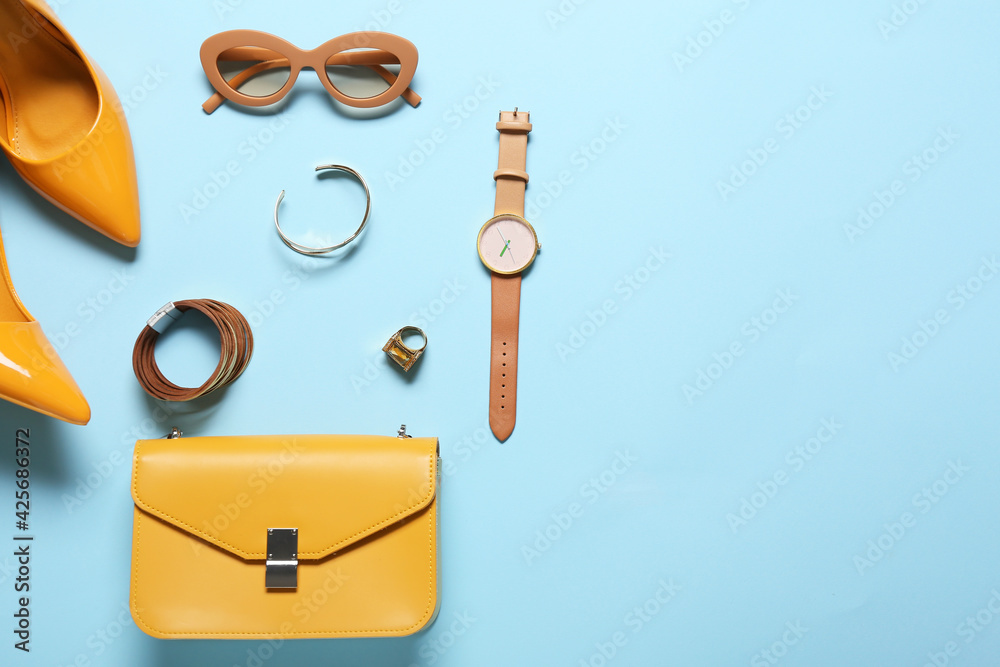Fototapeta premium Stylish female accessories on color background