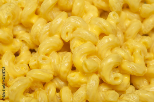 Pasta background. Mac and Cheese pasta close up background. American style Italian pasta with cheese.