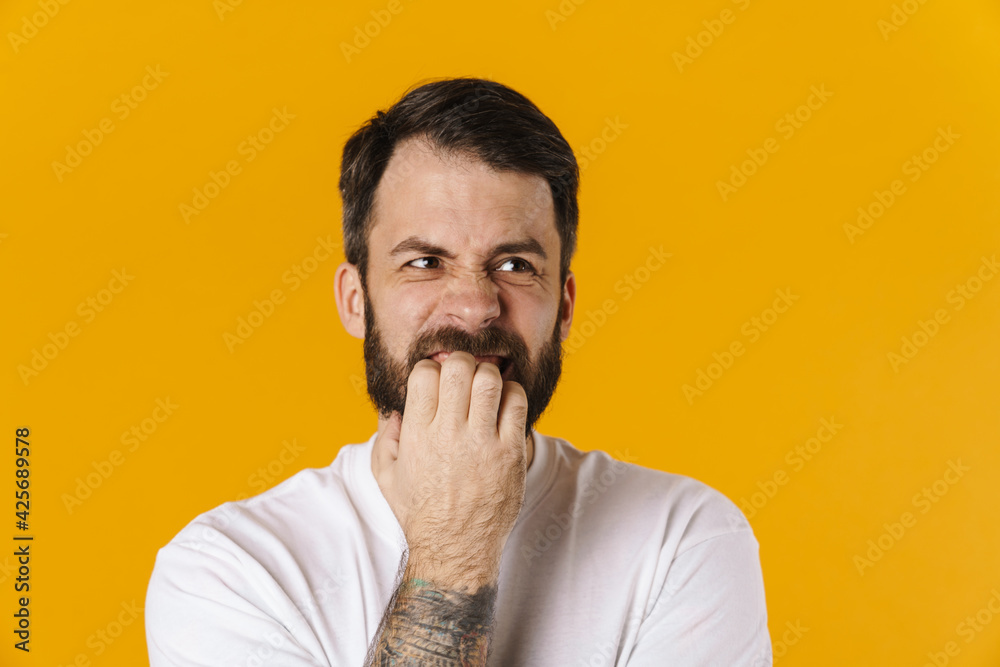Portrait of a concerned brunette bearded man Portrait of a concerned brunette bearded man
