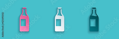 Paper cut Wine bottle icon isolated on blue background. Paper art style. Vector