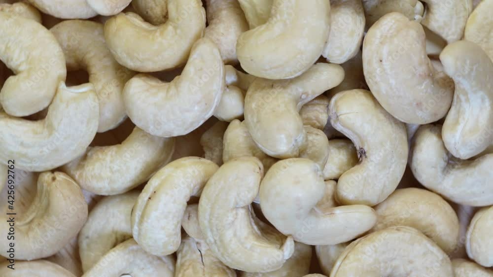Top view Rotate Fresh cashew nut on wooden Background, 4K . Top view Rotate Fresh cashew nut on wooden Background, 4K .