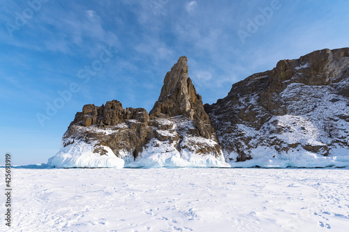 Ice-covered Ogoy Island in the Maloye More Bay of Lake Baikal in winter. Siberia  Russia