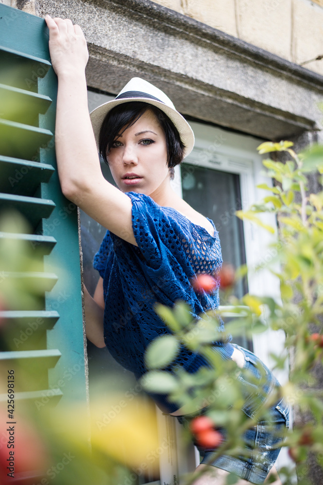 cute girl with a hat and blue shirt
