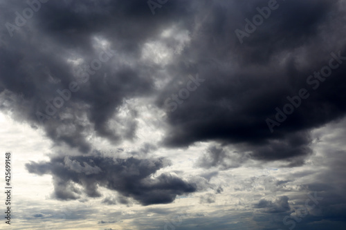 Sky covered with dark storm clouds. Dramatic background for weather before rain © Oleg