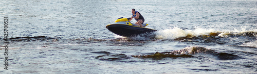 Fotografia Man speeding on jet ski on lake during summer vacation