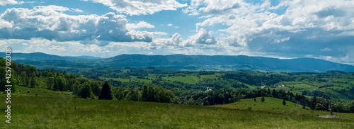 Branna village with hills around from Alojzovske louky meadows in Jeseniky mountains in Czech republic