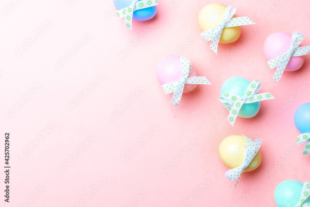 Easter background pink. Colourful egg with tape ribbon on pastel pink background in Happy Easter decoration. Flat lay, top view. Easter background pink. Colourful egg with tape ribbon on pastel pink background in Happy Easter decoration. Flat lay, top view.