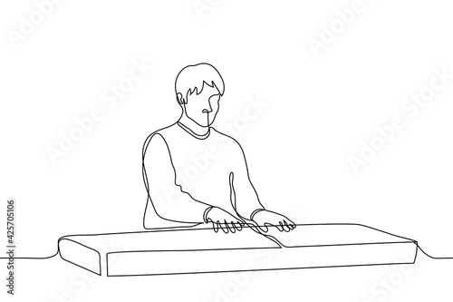 man sitting at a synthesizer - one line drawing. musician playing keyboard