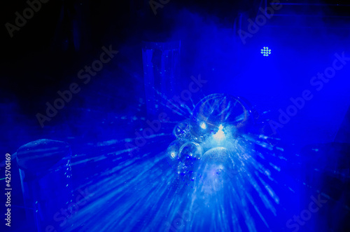 Disco ball with bright rays and smoke