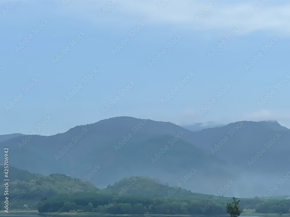 The atmosphere of the tent with a view of the surroundings and the mountains and there is a thin mist nearby and beautiful pine trees all around. The atmosphere of the tent with a view of the surroundings and the mountains and there is a thin mist nearby and beautiful pine trees all around.