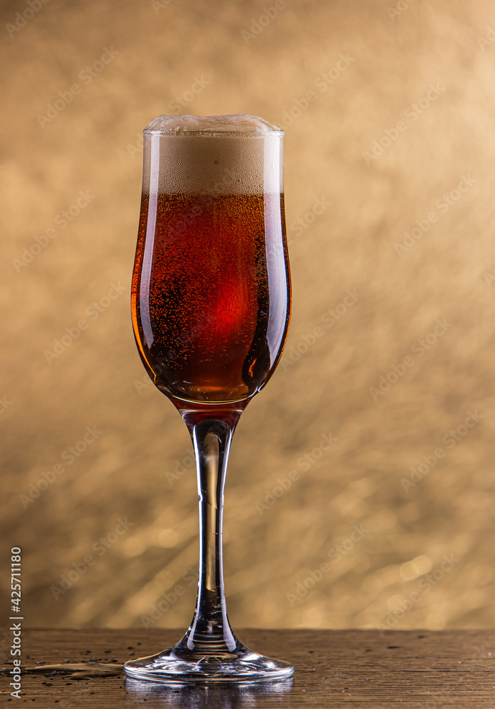 glass of beer on table glass of beer on table