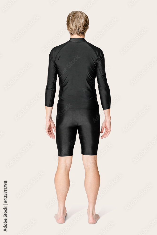 Fototapeta premium Mature man in black rash guard and shorts swimwear fashion rear view