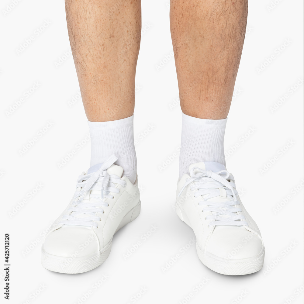 White sneakers and high socks for street fashion shoot with design space White sneakers and high socks for street fashion shoot with design space