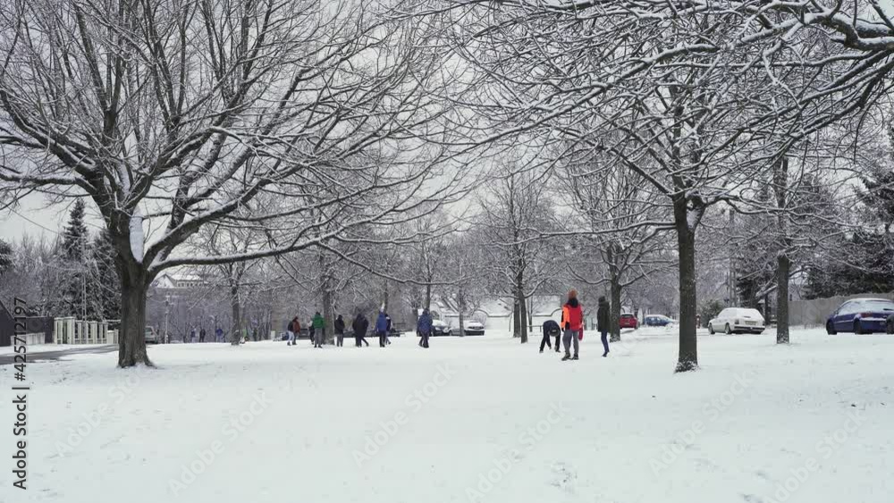 Kids enjoying the snowfall in a small European town.Kids enjoying the snowfall in a small European town. Kids enjoying the snowfall in a small European town.Kids enjoying the snowfall in a small European town.