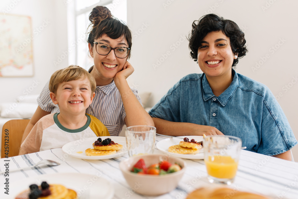 Beautiful family at breakfast table