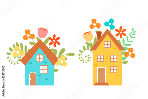 Set of cute vector houses isolated on white background.  Hand-drawn houses surrounded by flowers. 