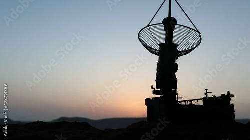 Space radar antenna on sunset. Silhouettes of satellite dishes or radio antennas against night sky. Creative artwork decoration. Selective focus