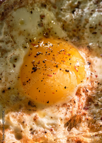 Fried egg, yolk close-up. Macro photography..