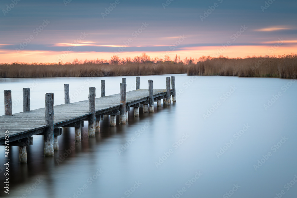 Jetty on lake Neusiedlersee in Burgenland long exposure on a morning