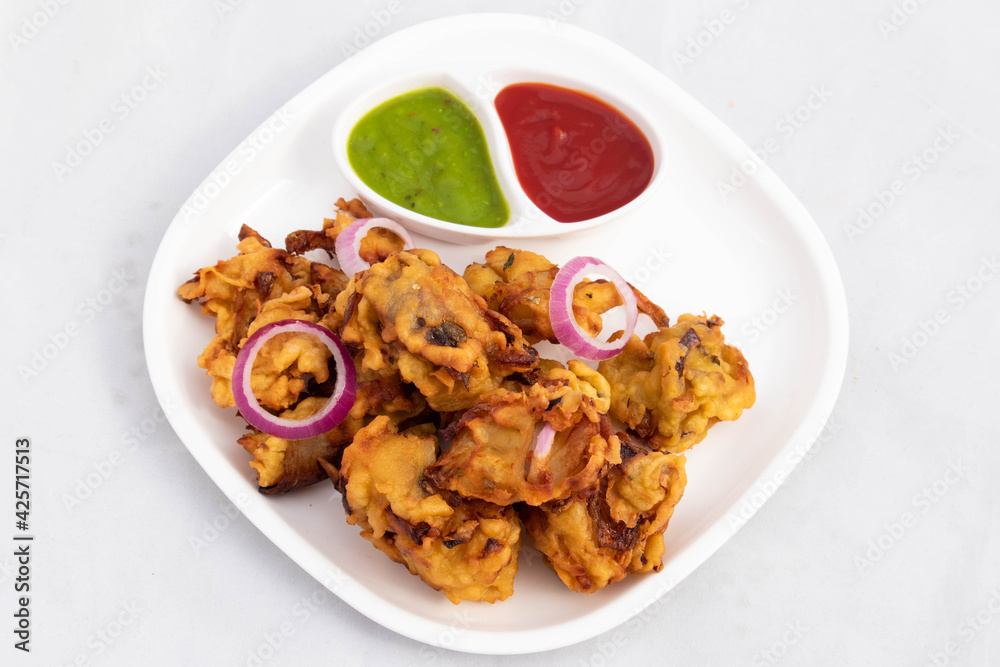 Indian Subcontinental Street Food With Various Names Like Onion Bhajji Pyaj Pakora Or Pakore Pyaaj Ke Pakode Or Pakoda Kanda Bhaji Pyaaz Bajji Served With Chutney And Ketchup Is Tea Time Chaat Snacks