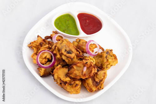 Indian Subcontinental Street Food With Various Names Like Onion Bhajji Pyaj Pakora Or Pakore Pyaaj Ke Pakode Or Pakoda Kanda Bhaji Pyaaz Bajji Served With Chutney And Ketchup Is Tea Time Chaat Snacks