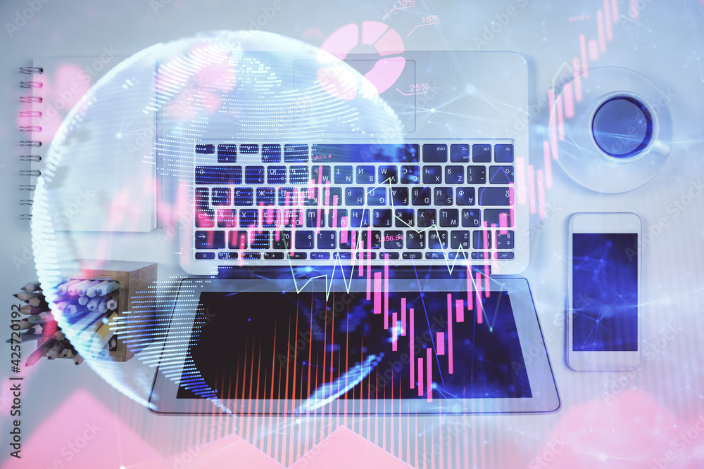 Business theme hologram drawings over computer on the desktop background. Top view. Multi exposure. Concept of international connections. Business theme hologram drawings over computer on the desktop background. Top view. Multi exposure. Concept of international connections.