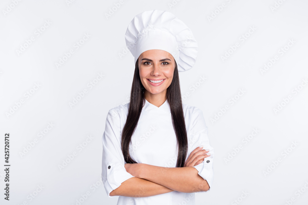 Portrait of pretty cheerful person crossed arms beaming smile look camera isolated on white color background Portrait of pretty cheerful person crossed arms beaming smile look camera isolated on white color background