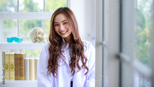 Smiling ethnic scientist in modern lab Free Download Smiling ethnic scientist in modern lab - GFXLoad