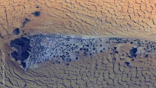 Desert landscape and oasis of Jubbah city in Saudi Arabia desert, sunrise animation on agricultural field. Images furnished by Nasa photo