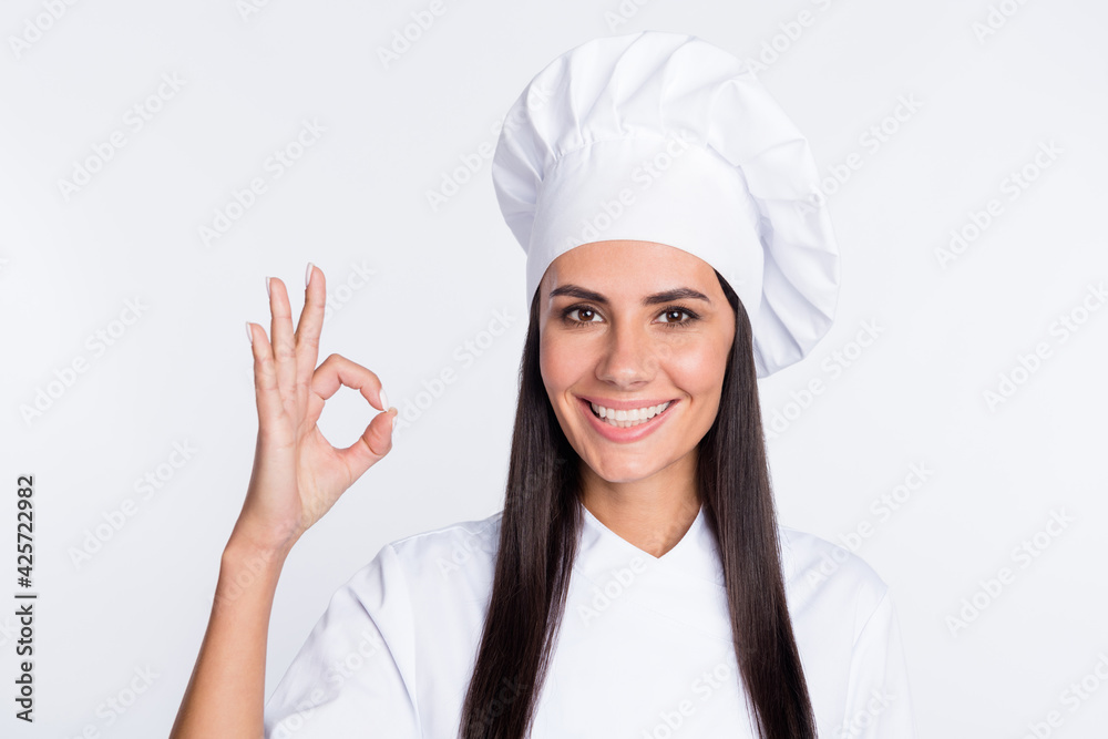 Portrait of charming positive person fingers show okey symbol toothy smile isolated on white color background Portrait of charming positive person fingers show okey symbol toothy smile isolated on white color background