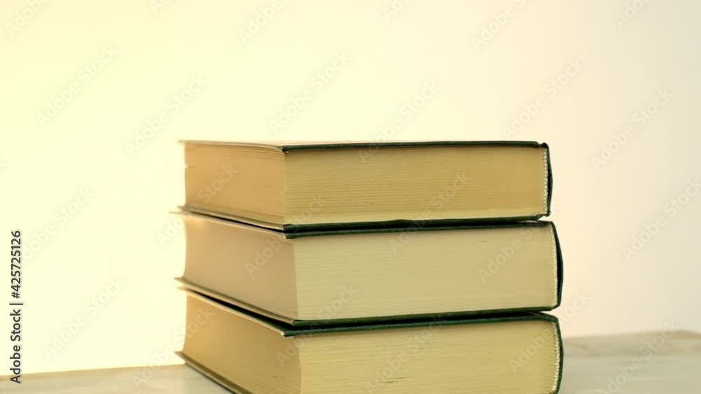 Reading books and literature. books stack set on a light beige background.Study and education concept.Learning and knowledge Reading books and literature. books stack set on a light beige background.Study and education concept.Learning and knowledge