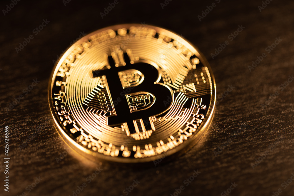 Gold Bitcoin shining. Crypto currency BTC. Concept of Crypto and Block chain technology. New Digital money Bitcoin and Ethereum Gold Bitcoin shining. Crypto currency BTC. Concept of Crypto and Block chain technology. New Digital money Bitcoin and Ethereum