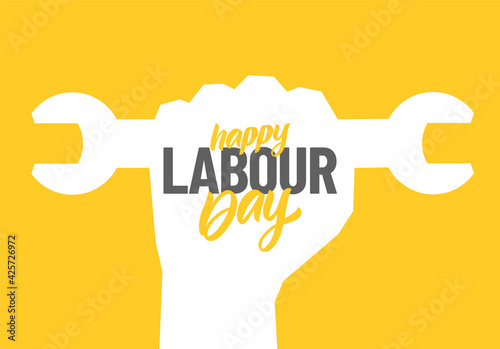 Silhouette of clenched fist with wrench, hand lettering composition of Happy Labour Day 1st of May