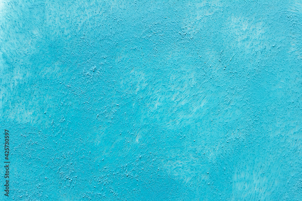 Textured blue acrylic paint background with marks left by sponge. Textured blue acrylic paint background with marks left by sponge.