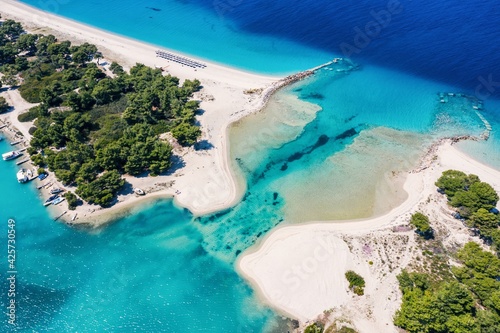 Beautiful Beach With Golden Sand And Clear Water. Turquoise coast with blue water and golden sand in Europe aerial drone photo photo