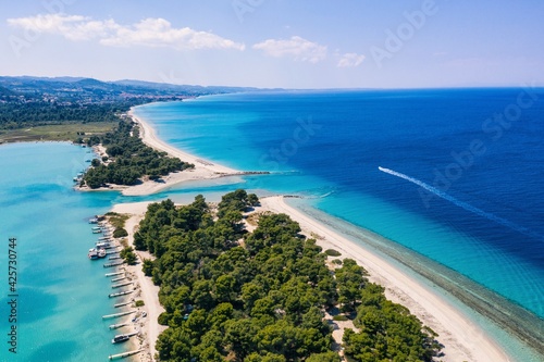 Beautiful Beach With Golden Sand And Clear Water. Turquoise coast with blue water and golden sand in Europe aerial drone photo