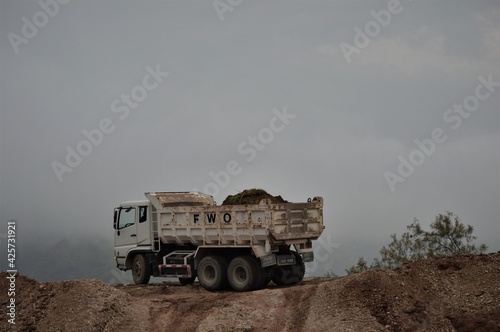 ISLAMABAD, PAKISTAN - JANUARY 27,2016: different view of truck standing of sand terrain for background, selective focus