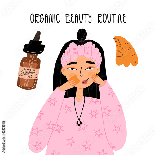 Young woman doing gua sha or jade scraper face massage face serum or oil. Clean beauty, Organic cosmetics concept.
