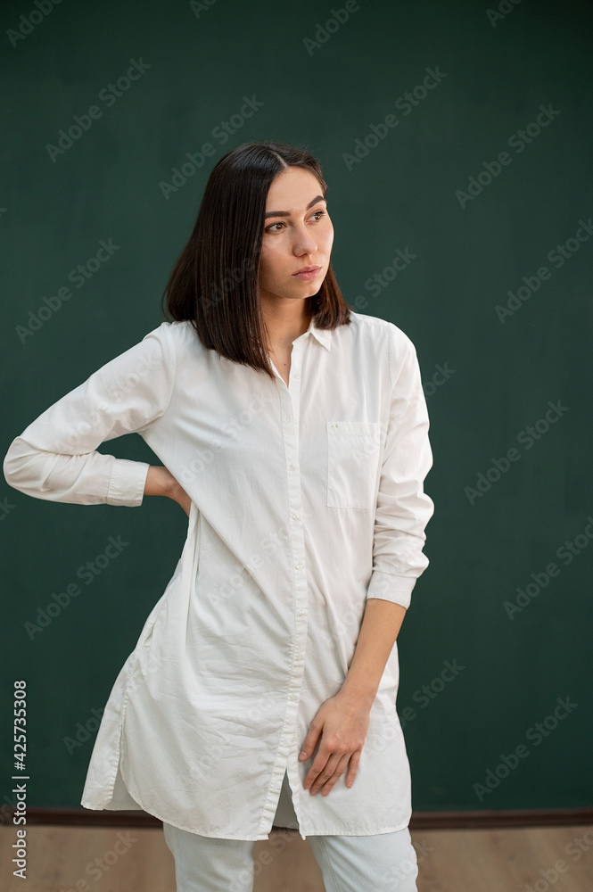women in white robe on the green background
