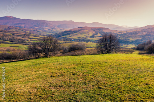 View of the colorful mountain slopes on an autumn sunny day. Mountain view in autumn. Beautiful natural landscape. Carpathian mountains. Ukraine